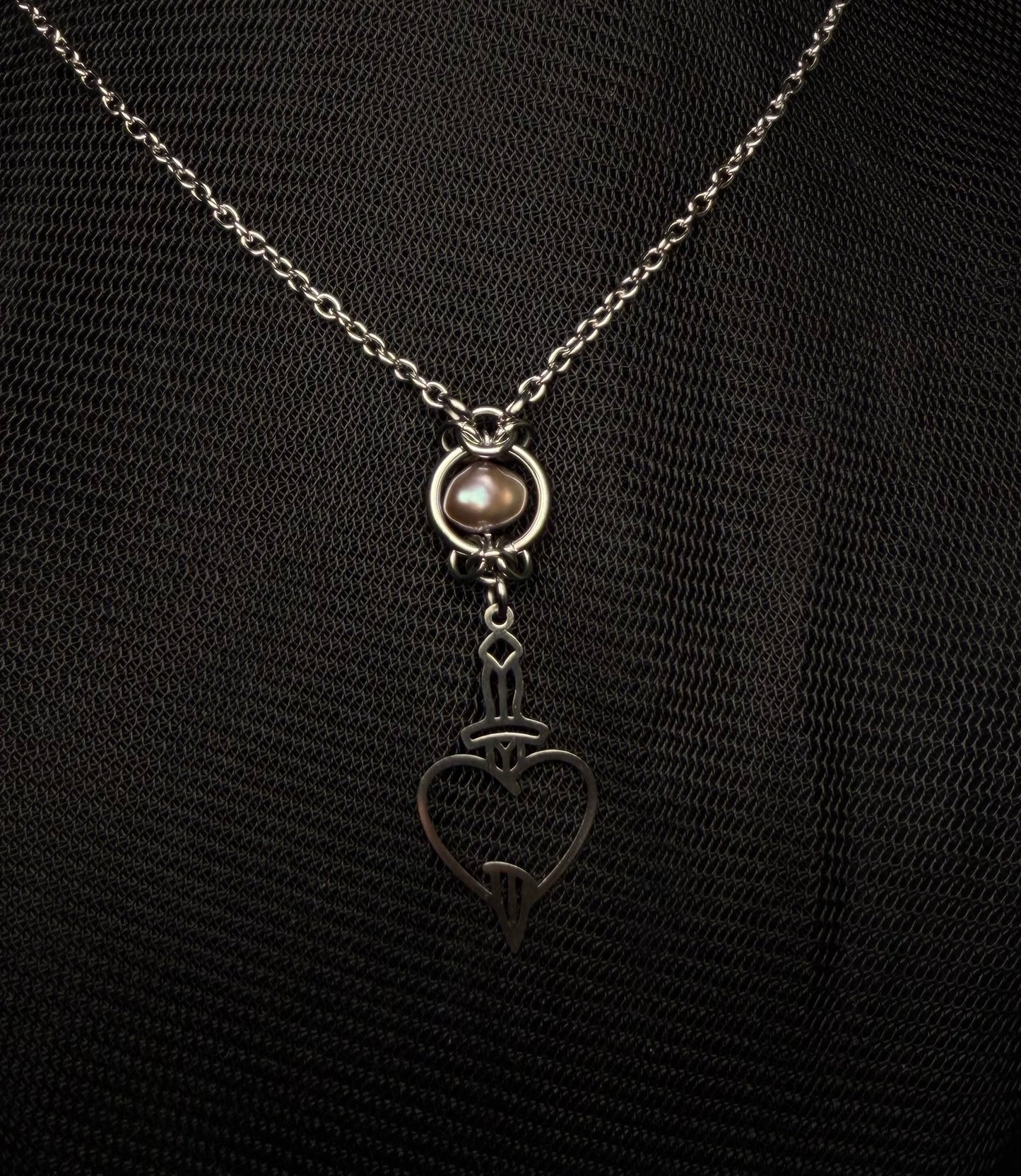 Pierced heart necklace